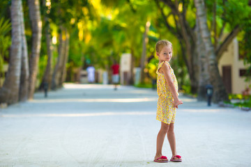 Adorable little girl during beach vacation having fun