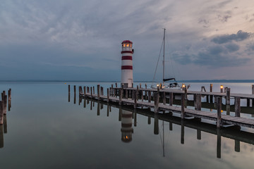 Lighthouse at Lake Neusiedl Austria short after sunset .