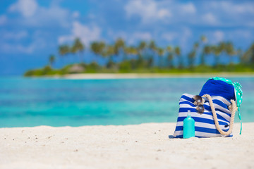 Beach accessories on white tropical beach