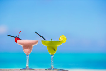 Two tasty cocktails on tropical white beach