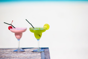 Two tasty cocktails on tropical white beach