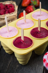 making homemade summer fruit lolly pops ice cream