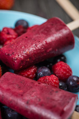 making homemade summer fruit lolly pops ice cream