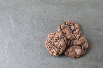 Chocolate chip cookies on slate background