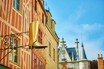 Golden signboard in form of a boot