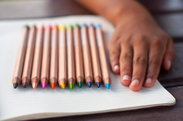 Colored pencils with hand