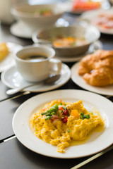 Omelets, breakfast served with coffee and croissants.