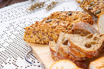 Sliced wholegrain bread on a wood cutting board
