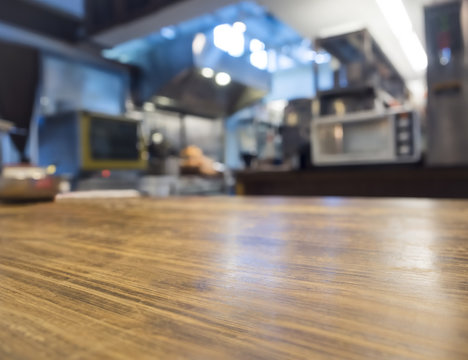 Table top counter with Blurred Kitchen Restaurant Interior 