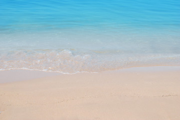 Fototapeta na wymiar Wave of sea on sand beach