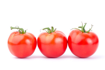 Fresh tomatoes on white background