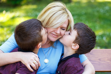 Mother with two sons in park