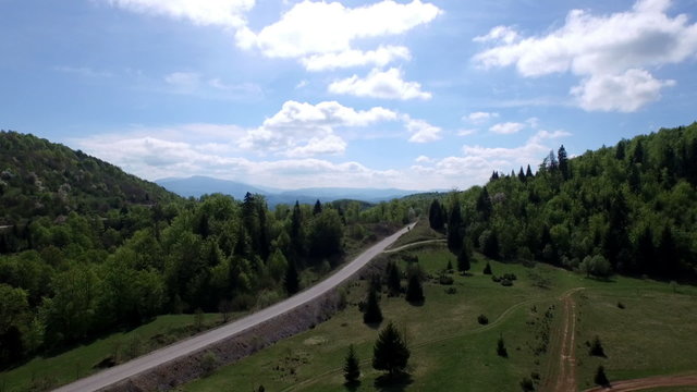 Aerial spring time footage of mountain road and amazing nature