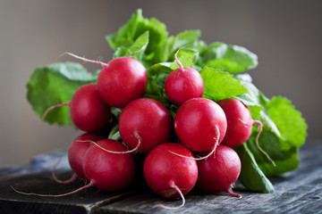 Fresh radishes on old wood