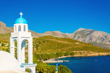 Typical Greek church with blue dome and sea Greece