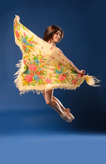 female ballet dancer jumping with headscarf