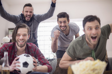 Group of men support the favorite football team
