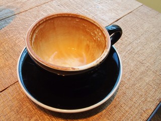 soft focus of black empty cup of coffee with stains