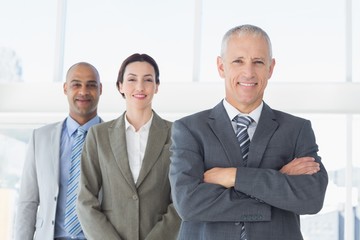 Business colleagues looking at camera