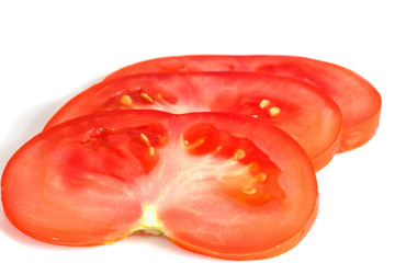 sliced tomato on white