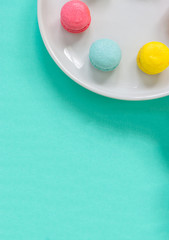 colorful macaron on green background