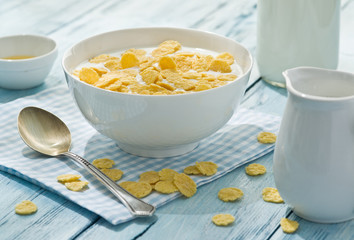 Cornflakes cereal and milk.