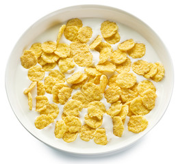 Cornflakes in the bowl on white background.