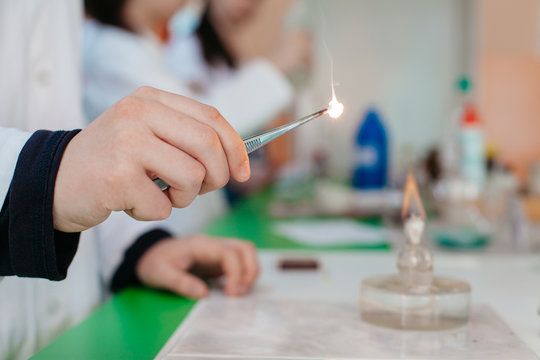students doing experiment with fire during chemistry class