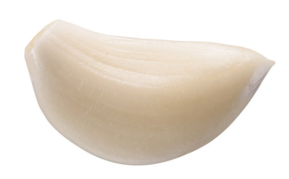Peeled garlic clove isolated on a white background.