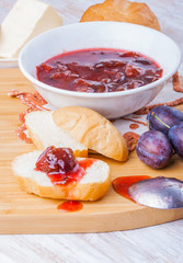 Roll with plum jam for breakfast