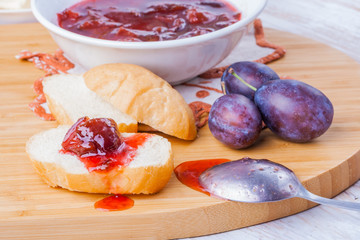 Roll with plum jam for breakfast