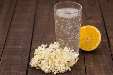 Homemade elderflower lemonade on rustic table