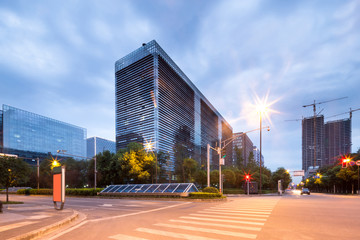 Fototapeta premium traffic blurred motion and office buildings