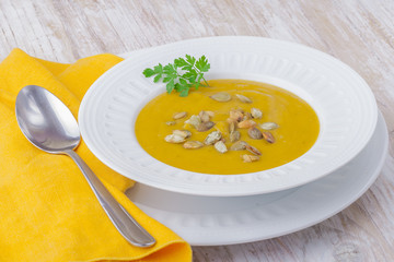 Pumpkin cream soup with roasted pumpkin seeds