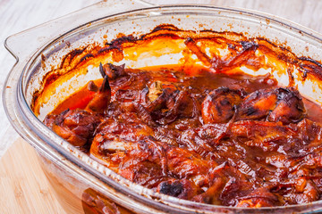 Chicken wings in red tomato sauce