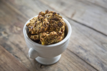 Homemade Oat cookies on wooden surface  