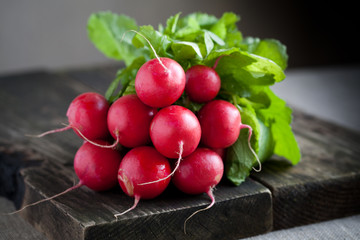 Fresh radishes on old wood