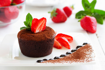 chocolate pudding with fudge center with strawberries,