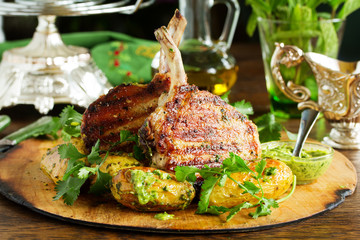 Grilled pork chop on the bone with spicy potatoes.  