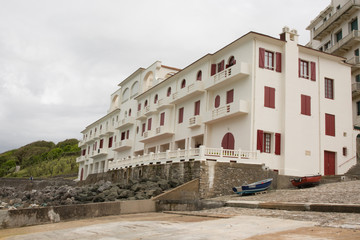 Fototapeta na wymiar red and white typical Basque hotel by the sea