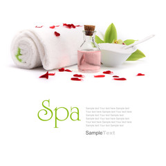 Spa concept. Oil, orchid and towel with red petals.