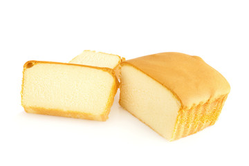 Sliced butter cake on white background