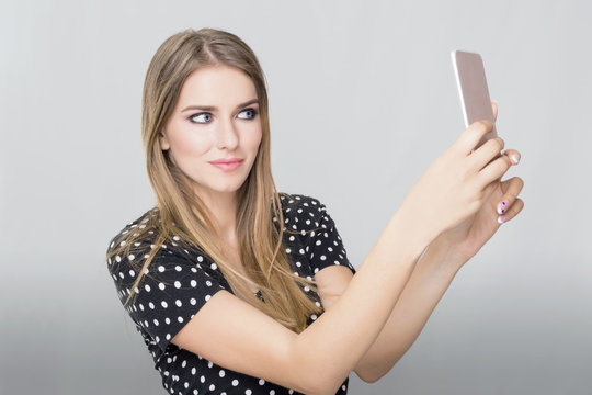 Woman taking a photo of herself 