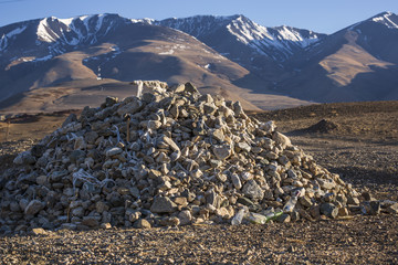 Pile of stones on a background of mountains