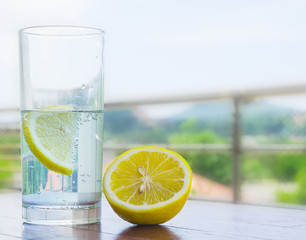 Glass of water with lemon - Powered by Adobe