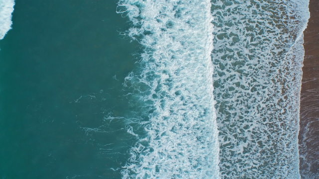 Overhead Aerial Footage. Waves Breaking Creating Texture. 