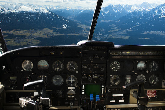 dashboard in airplane cockpit and mountains view