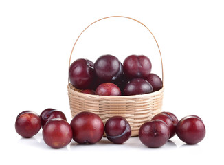 Sweet ripe cherry in the basket on white background