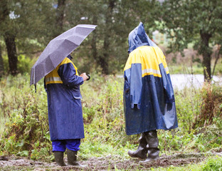 Working going to rain on a muddy road