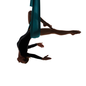 Aerial performer hanging in butterfly pose